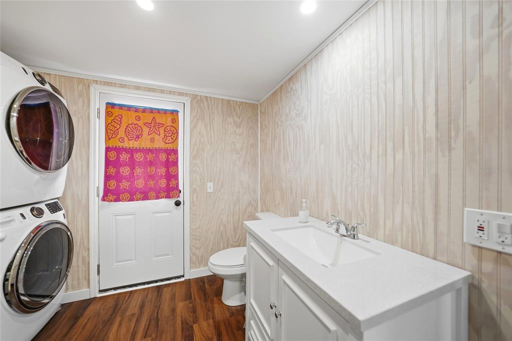 8164 Archie Street Englewood, FL 34224 - Photo 14 of 42 a bathroom with a sink and a mirror