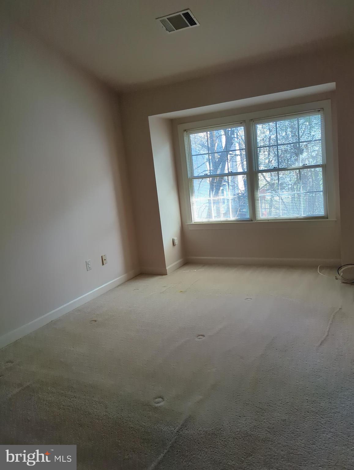 11223 Watermill Lane Silver Spring, MD 20902 - Photo 11 of 20 an empty room with windows
