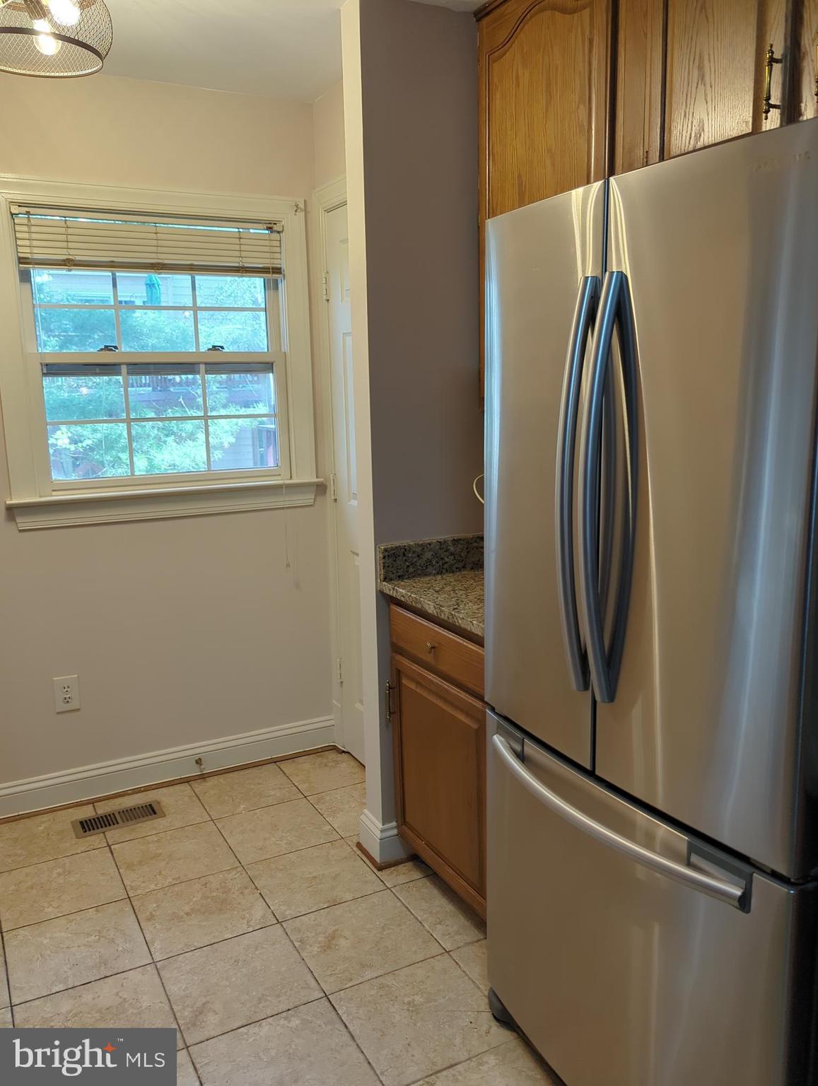 11223 Watermill Lane Silver Spring, MD 20902 - Photo 4 of 20 a view of a refrigerator and window