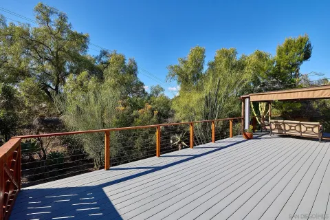a view of balcony with furniture