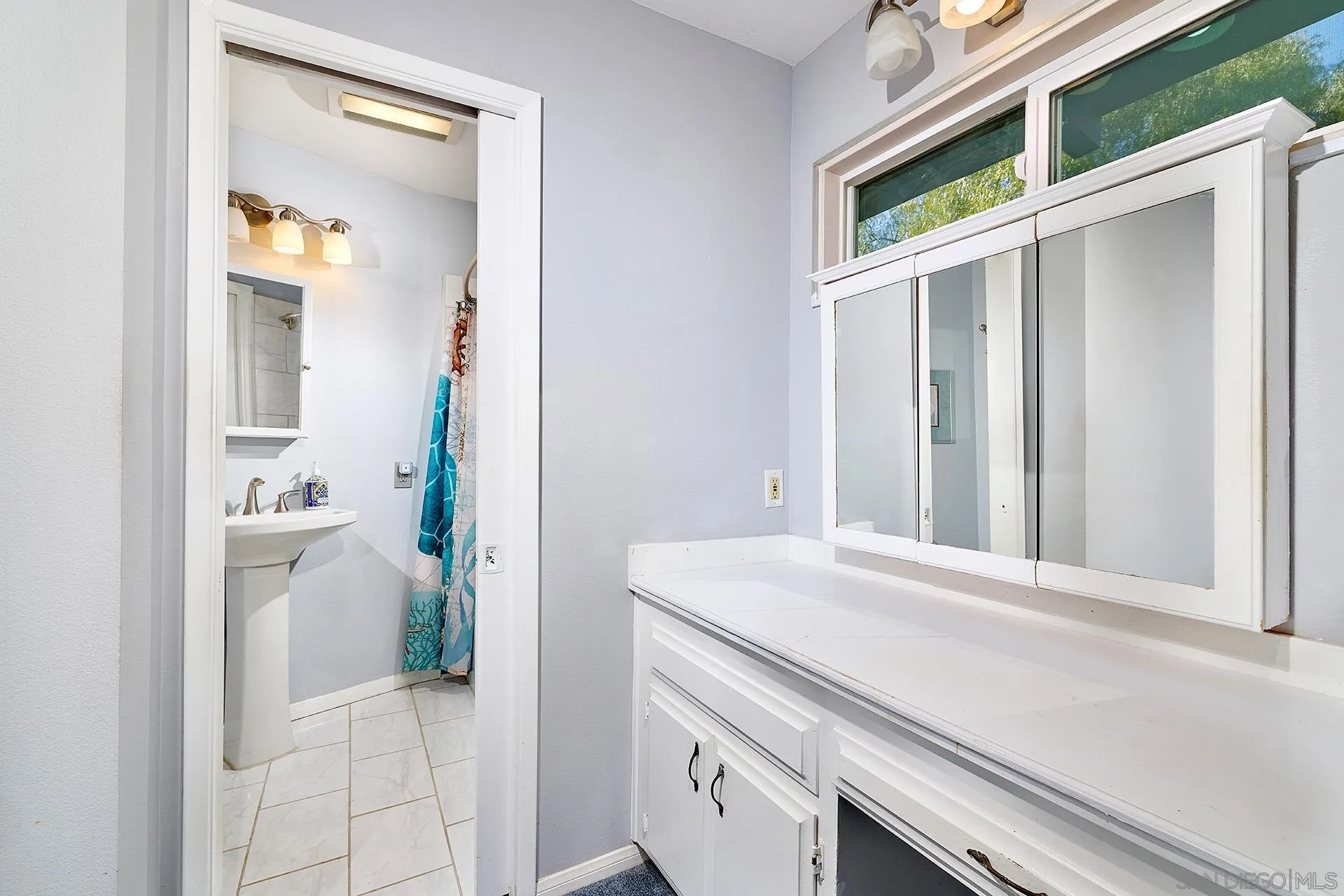 15260 Vali Hai Road Poway, CA 92064 - Photo 14 of 40 a view of a bathroom with a sink and a mirror