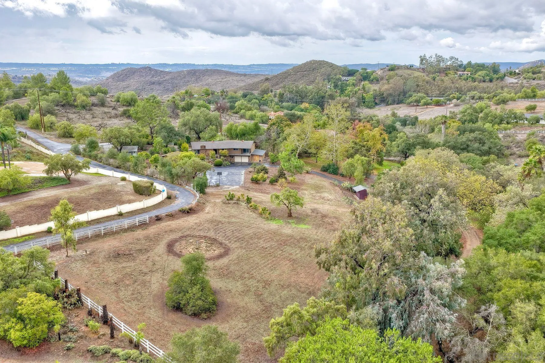 15260 Vali Hai Road Poway, CA 92064 - Photo 38 of 40 an aerial view of a swimming pool with a yard