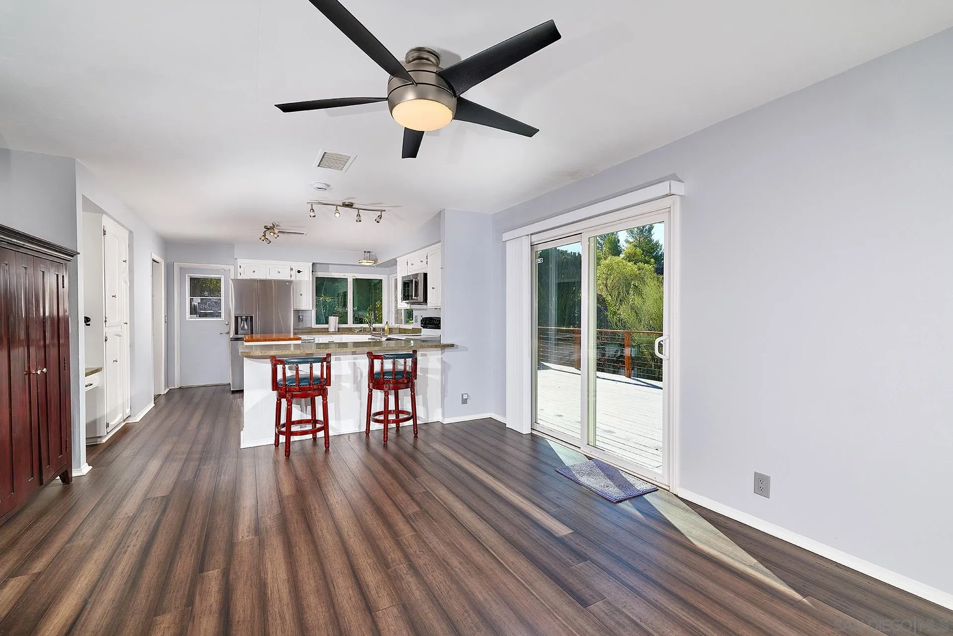 15260 Vali Hai Road Poway, CA 92064 - Photo 9 of 40 a view of a dining room with furniture window and wooden floor