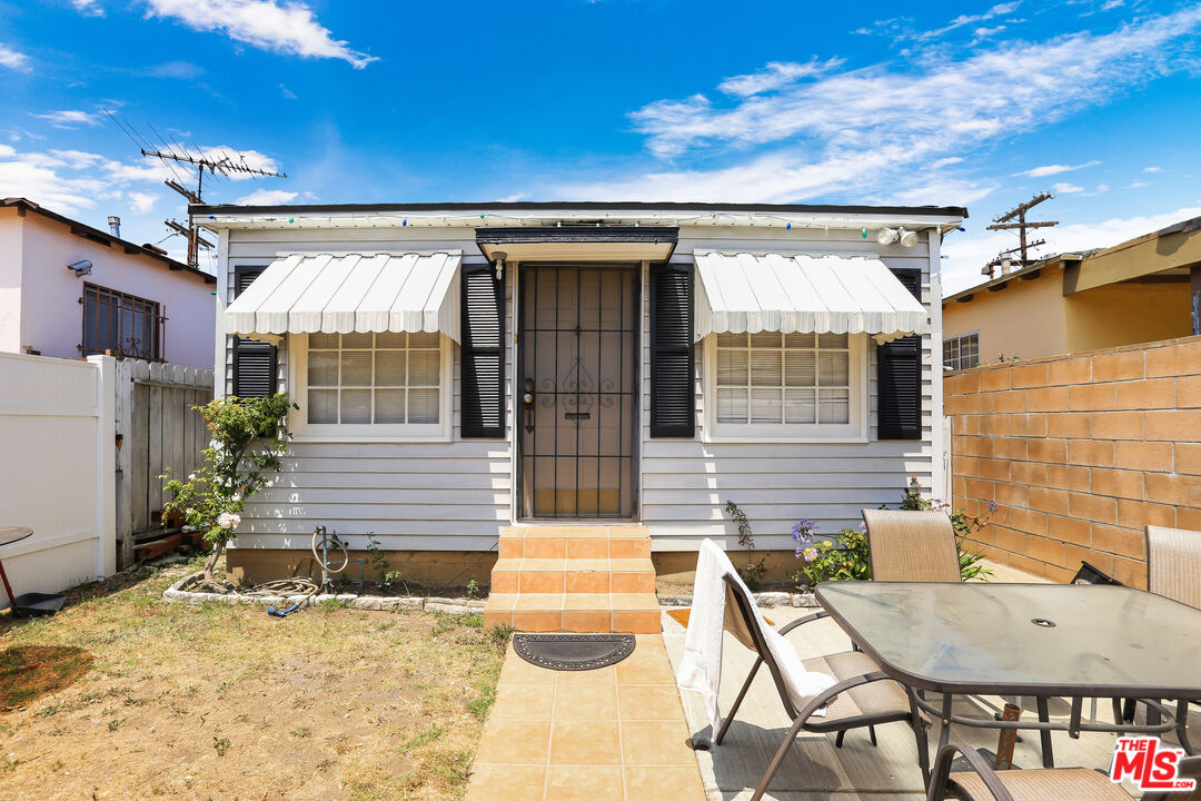 8905 Cattaraugus Avenue Los Angeles, CA 90034 - Photo 1 of 18 a balcony with table and chairs
