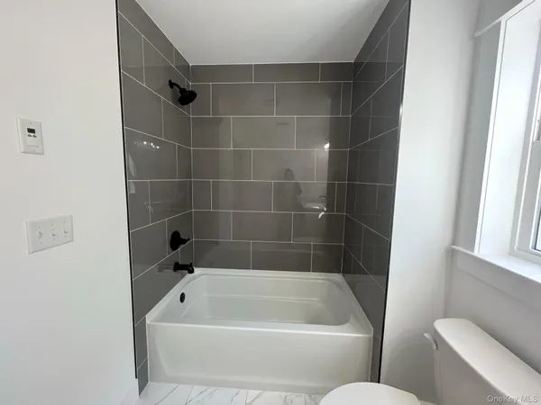 a bathroom with a bath tub