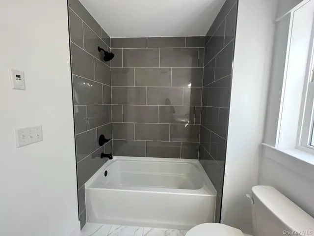 a bathroom with a bath tub