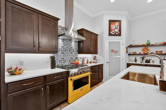 an aerial view of a house with a swimming pool