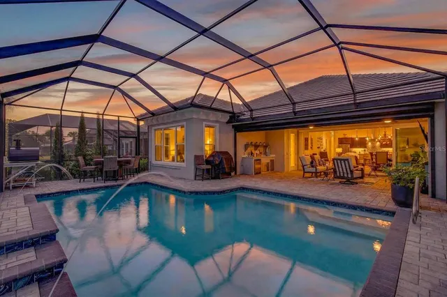 a kitchen with stainless steel appliances granite countertop a stove and a refrigerator