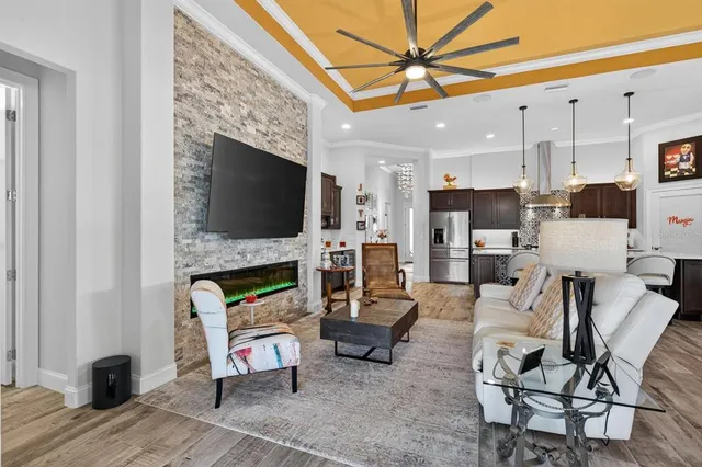 a utility room with stainless steel appliances a sink and cabinets