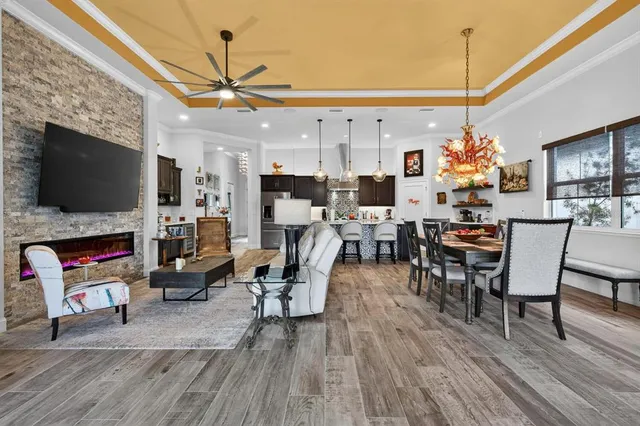 a view of a patio with table and chairs under an umbrella