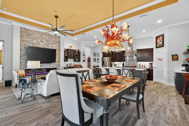 a view of a patio with table and chairs under an umbrella