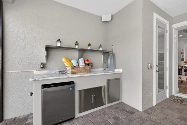 a bathroom with a granite countertop sink a toilet and a mirror