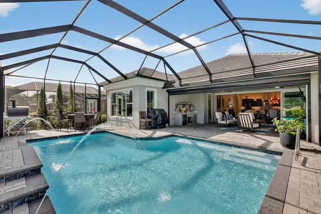 a view of walk in closet with clothes