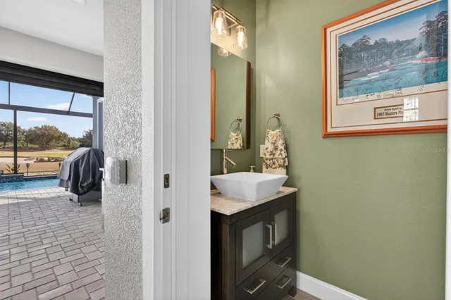 a view of a house with a patio and a yard