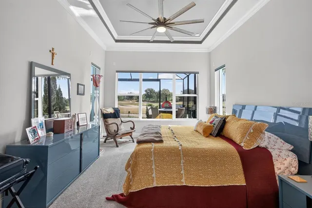 an aerial view of residential houses with outdoor space and ocean view