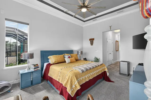 a view of a swimming pool with a patio and a yard