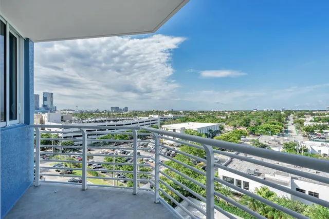 a view of a city from a balcony with an outdoor space