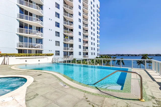 a view of swimming pool from a balcony