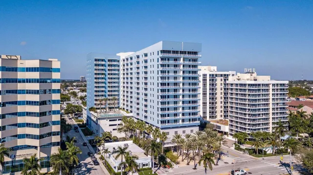 a view of a house with swimming pool and furniture
