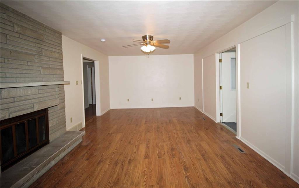 258 Douglass Road Beaver Falls, PA 15010 - Photo 8 of 25 Large Living Room with a Stone Fireplace