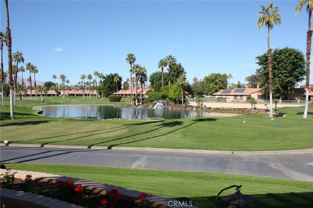 a front view of a house and a yard