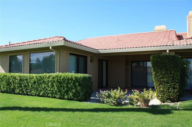 a view of a house with garden