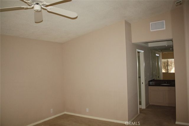a view of a room with a walk in closet