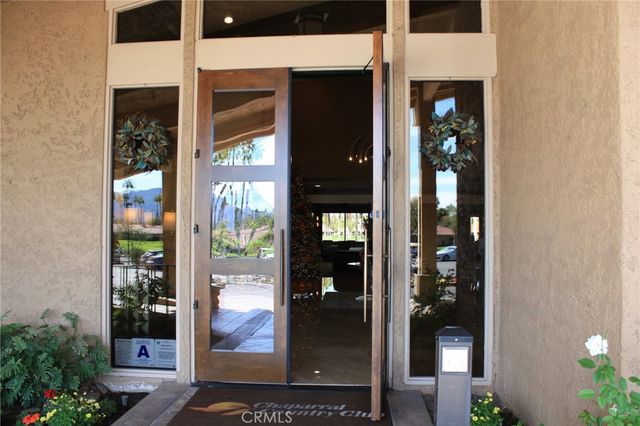 a view of potted plant in front of a door