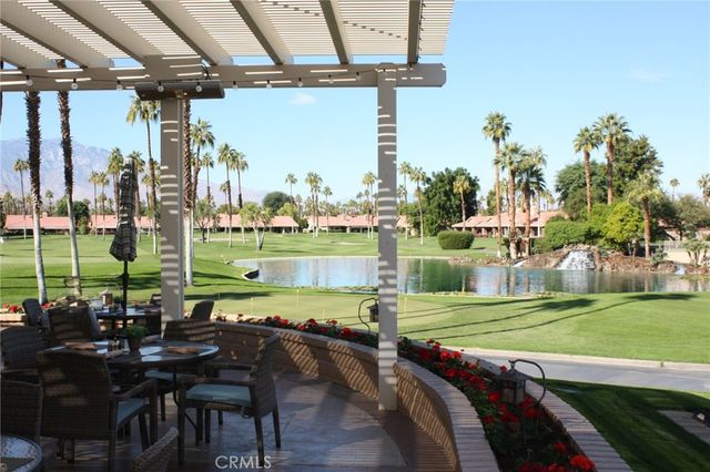 a view of a swimming pool and a yard