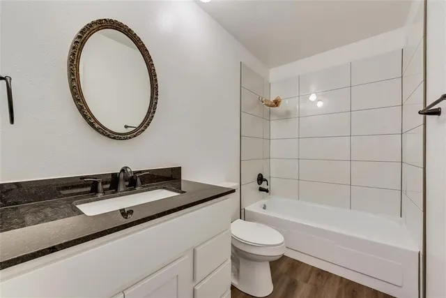 a bathroom with a sink a toilet and a bathtub