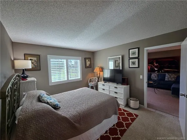 a bedroom with a bed and furniture