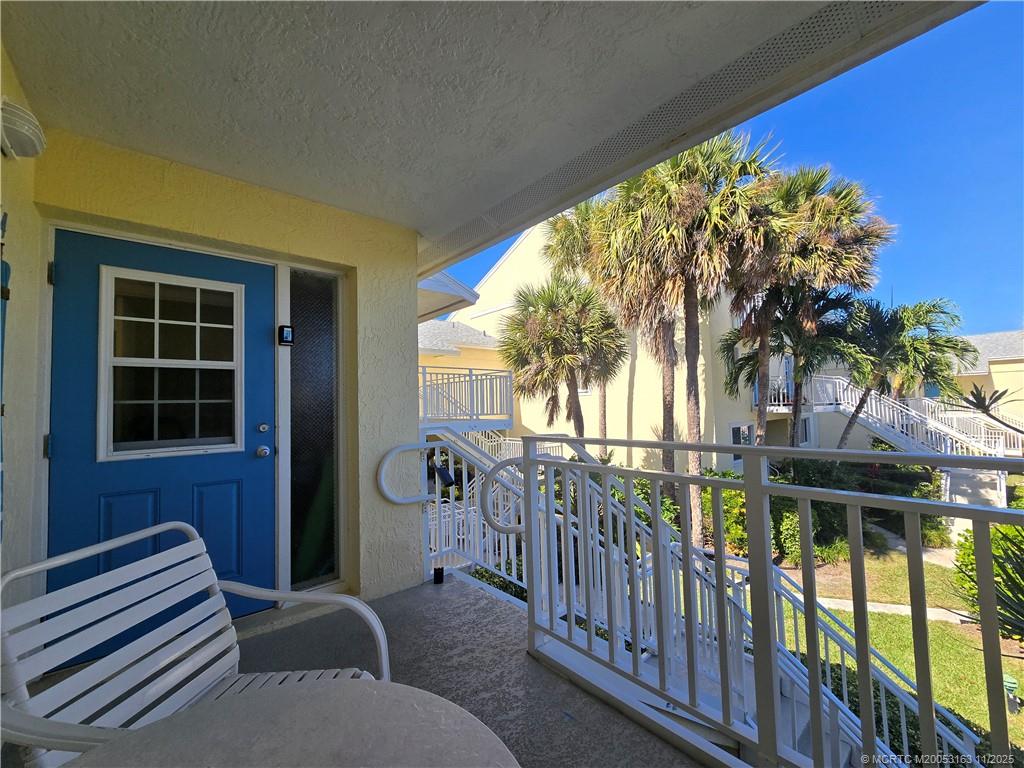 5564 Northeast Gulfstream Way Stuart, FL 34996 - Photo 4 of 41 a view of a house with a porch