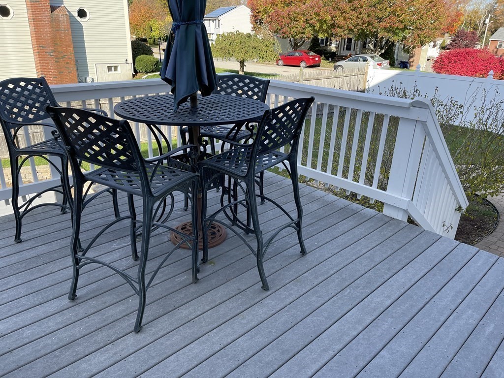 5 Collins Circle Weymouth, MA 02190 - Photo 14 of 42 a table and chairs with the wooden floor