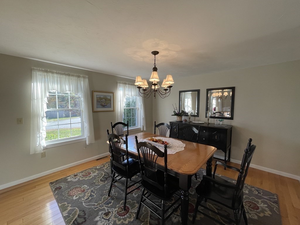 5 Collins Circle Weymouth, MA 02190 - Photo 22 of 42 a view of a dining room with furniture and chandelier