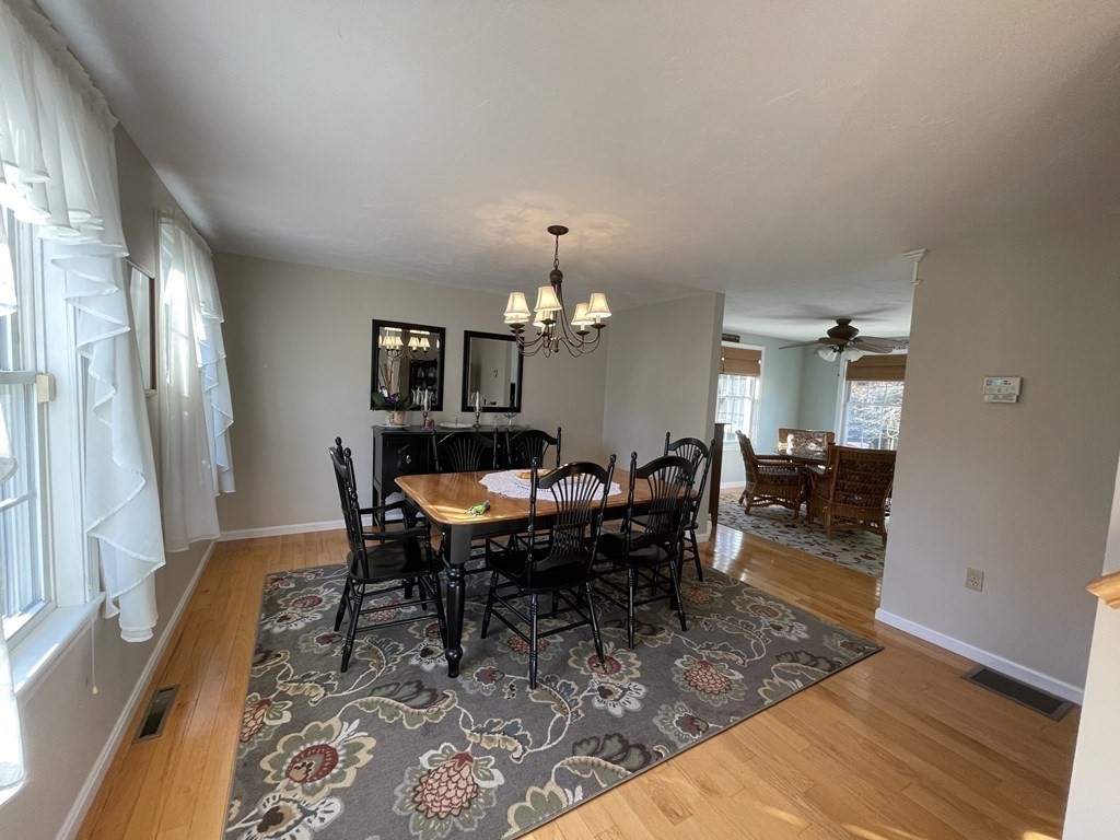 5 Collins Circle Weymouth, MA 02190 - Photo 24 of 42 a view of a dining room with furniture and a chandelier
