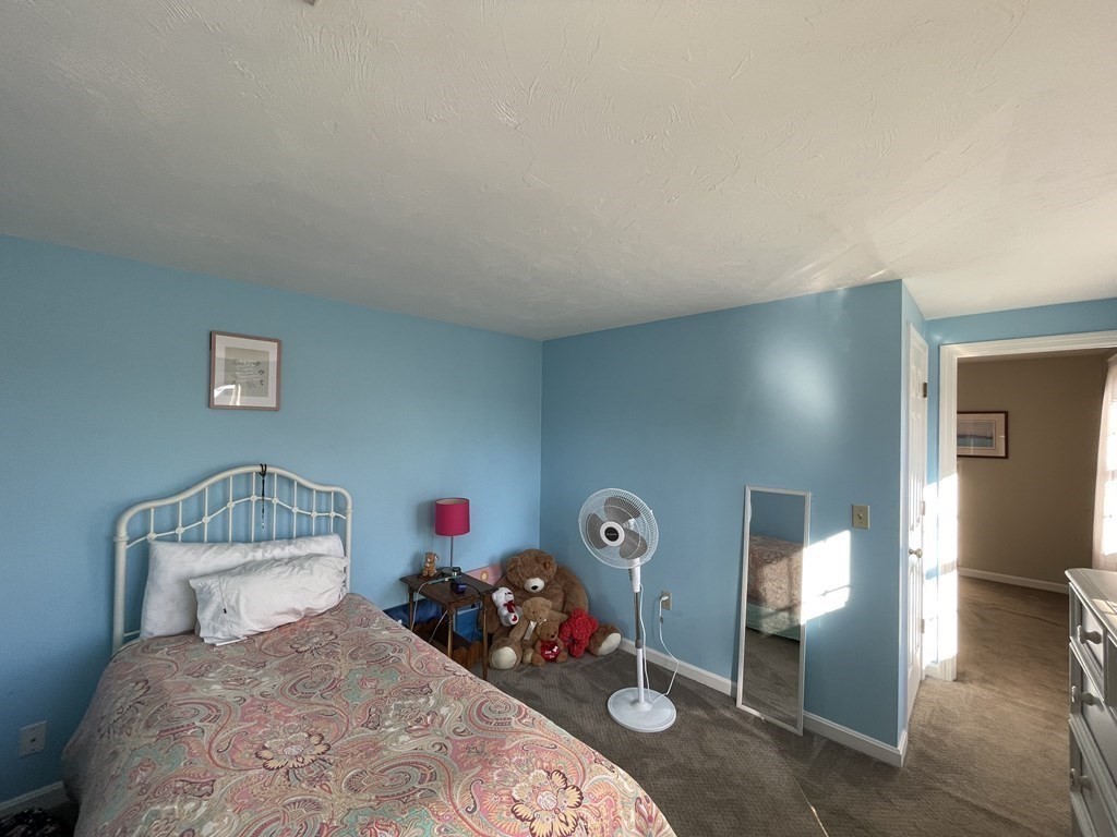 5 Collins Circle Weymouth, MA 02190 - Photo 28 of 42 a view of a livingroom with bed