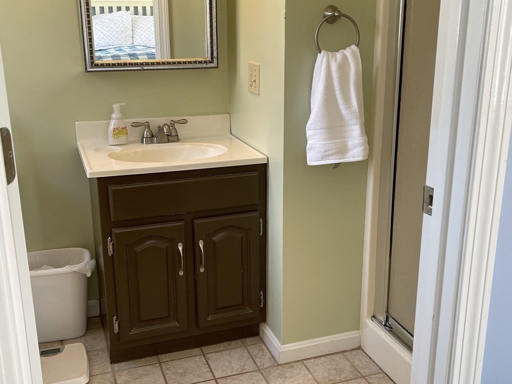 5 Collins Circle Weymouth, MA 02190 - Photo 35 of 42 a bathroom with a sink and a mirror