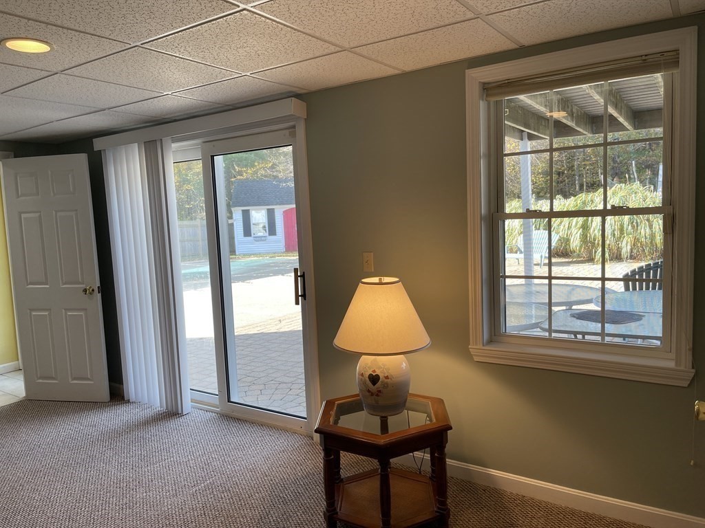 5 Collins Circle Weymouth, MA 02190 - Photo 36 of 42 a view of a room that has a window and chair in it
