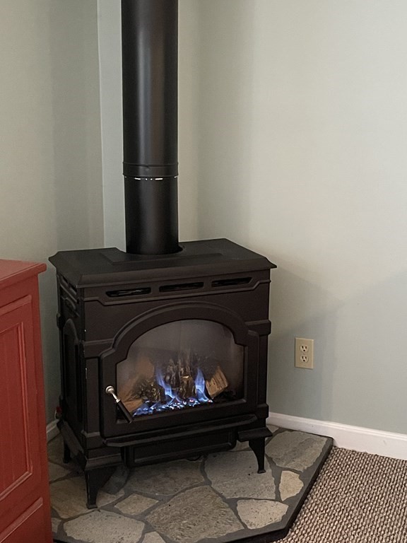 5 Collins Circle Weymouth, MA 02190 - Photo 40 of 42 a living room with furniture and a fireplace
