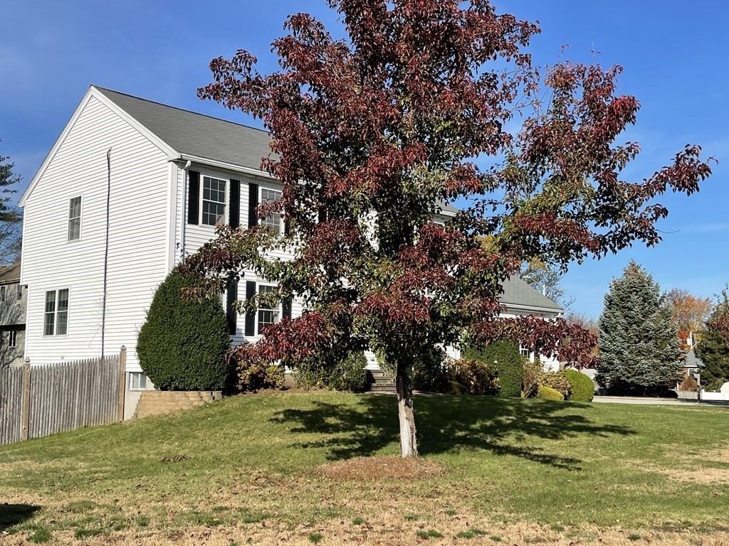5 Collins Circle Weymouth, MA 02190 - Photo 4 of 42 a front view of a house with a yard