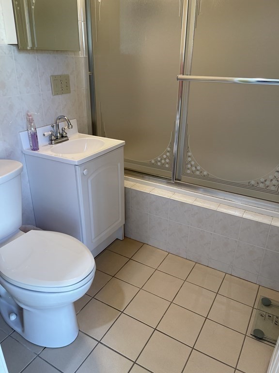 5 Collins Circle Weymouth, MA 02190 - Photo 41 of 42 a bathroom with a sink toilet and shower