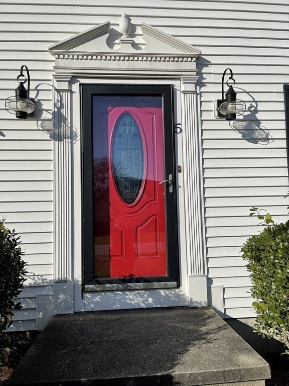 5 Collins Circle Weymouth, MA 02190 - Photo 42 of 42 a view of a red door of the house with an outdoor space