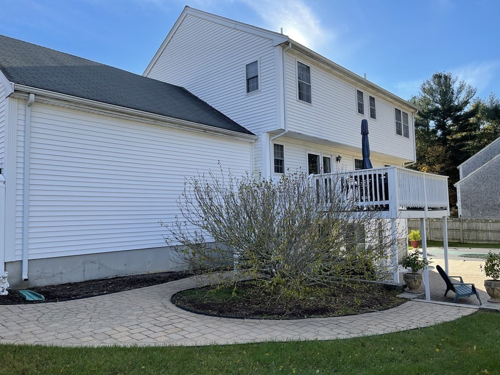 5 Collins Circle Weymouth, MA 02190 - Photo 5 of 42 a front view of a house with garden