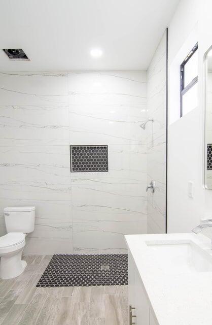 8126 Thruso Road Port Charlotte, FL 33981 - Photo 21 of 32 a bathroom with a sink a toilet and shower