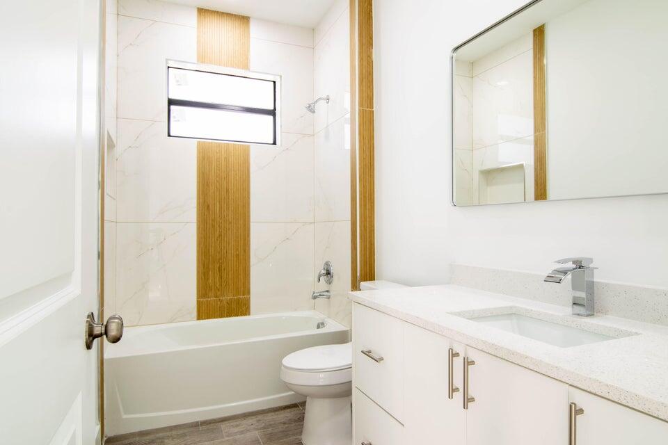 8126 Thruso Road Port Charlotte, FL 33981 - Photo 26 of 32 a bathroom with a sink a toilet and shower