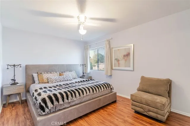 a bedroom with a bed and a couch