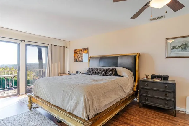 a bedroom with a bed and large window