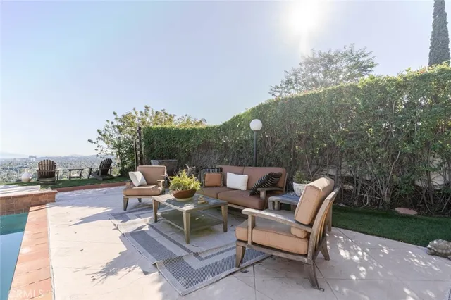 a backyard of a house with table and chairs