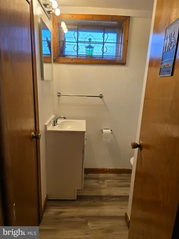 a view of a door and wooden floor