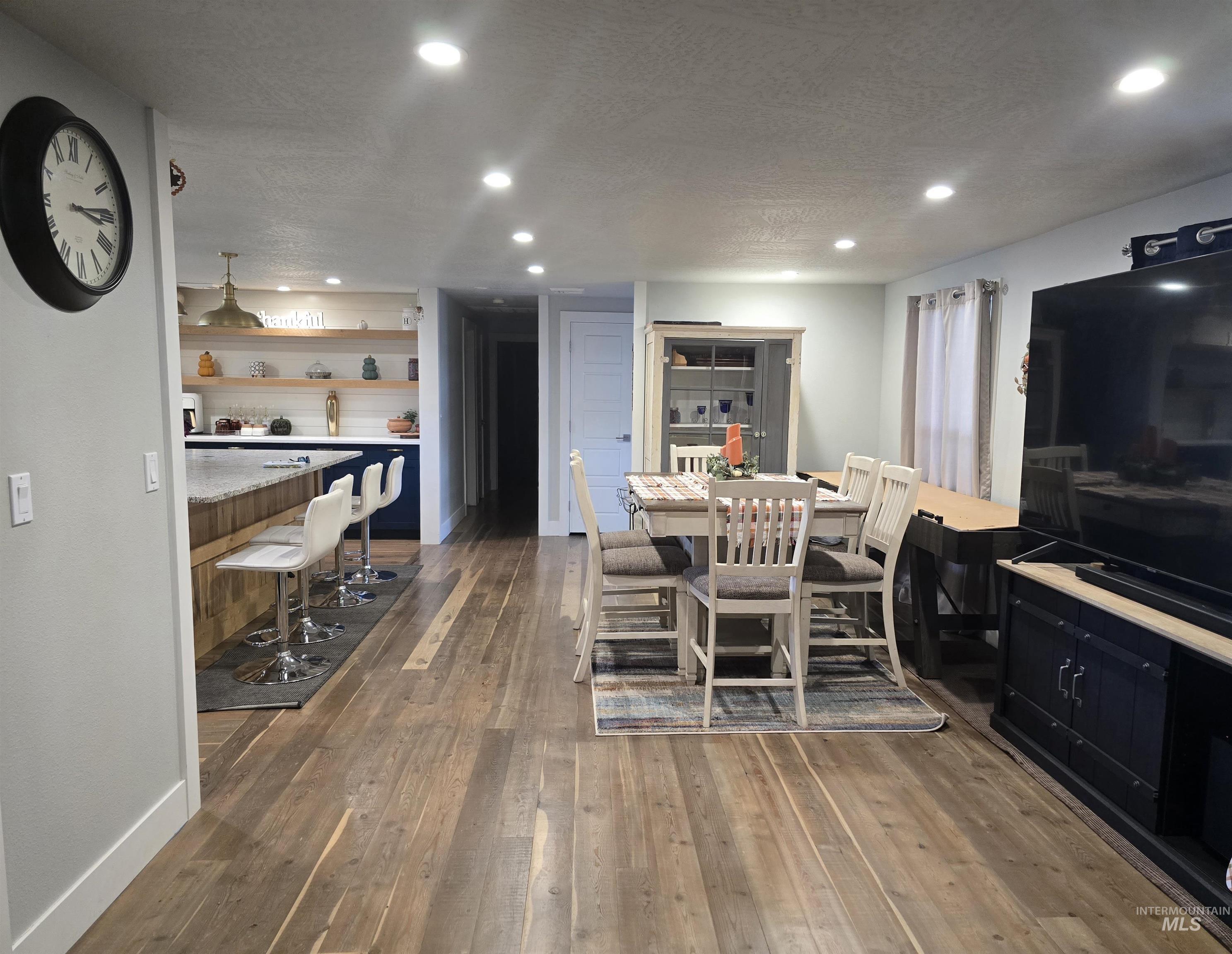 1265 West 1st Street Weiser, ID 83672 - Photo 9 of 23 Dining area with dark wood-style flooring, recessed lighting, and a textured ceiling